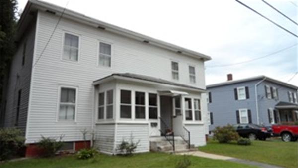 69 North Street Three Rivers, MA 01080 - Photo 1 of 4 a front view of a house with a yard