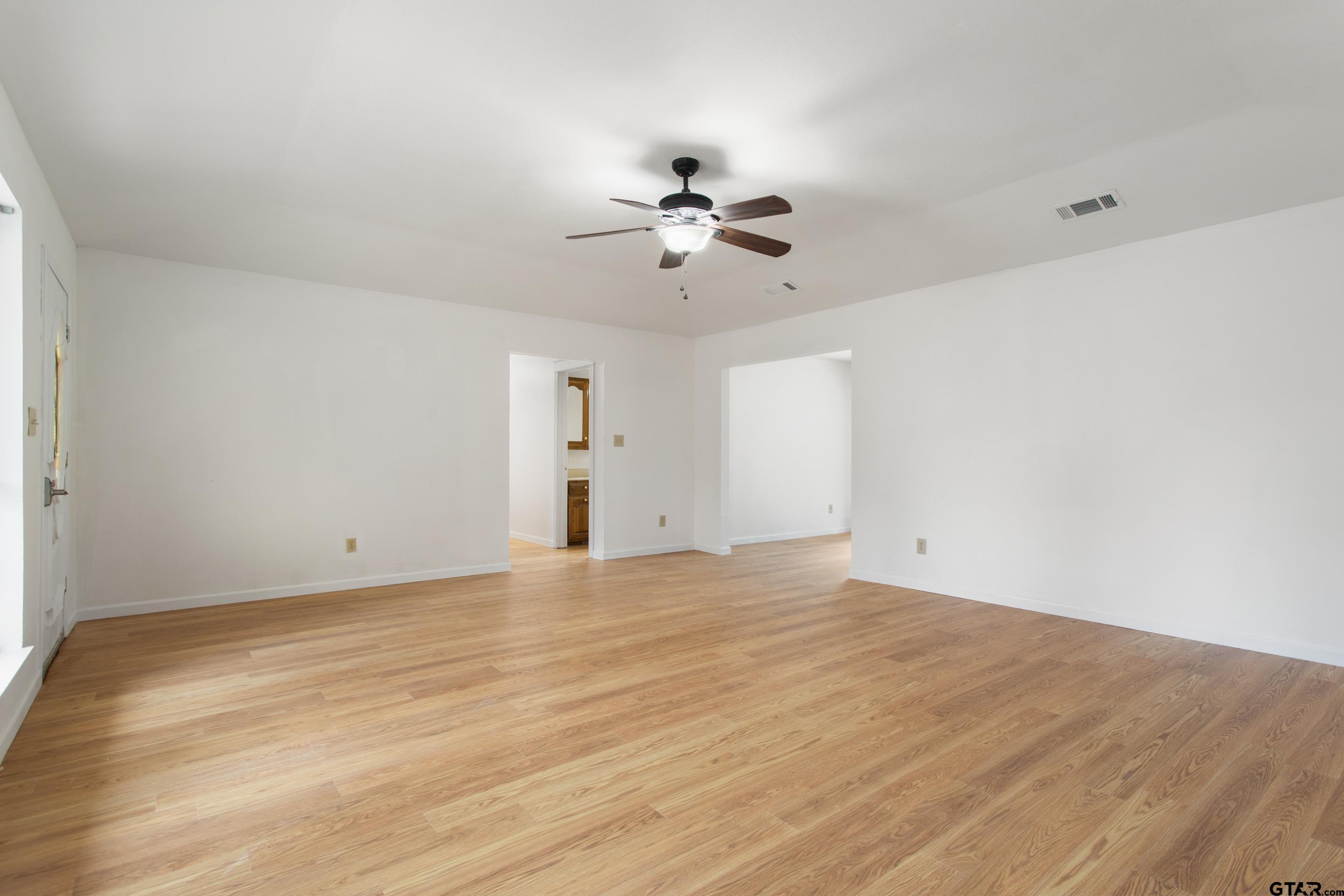 208 Treetop Lane Hideaway, TX 75771 - Photo 32 of 32 a view of an empty room with a ceiling fan