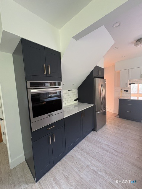 33 Flanders Road Bethlehem, CT 06751 - Photo 9 of 18 a kitchen with stainless steel appliances a stove a refrigerator and a sink