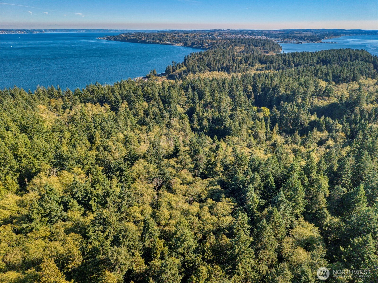 0 Skunk Bay Road Northeast Hansville, WA 98340 - Photo 13 of 19 a view of a lake with a mountain