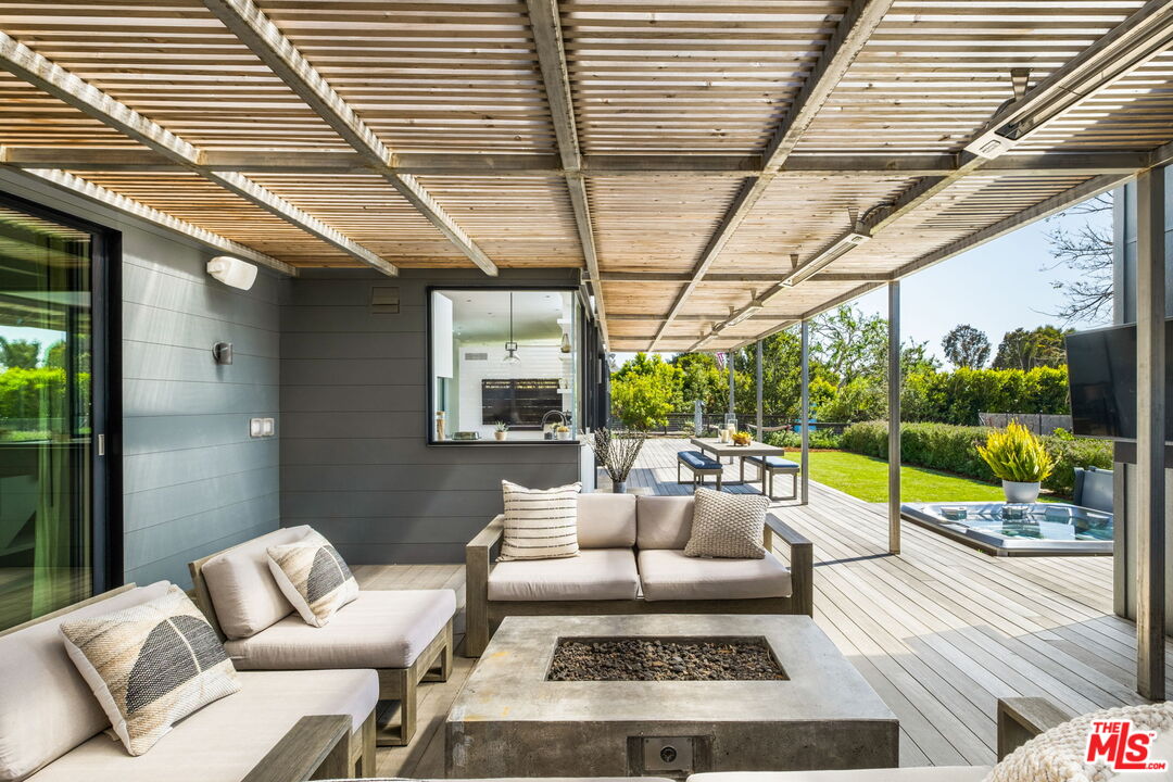 6755 Dume Drive, Unit GH Malibu, CA 90265 - Photo 12 of 31 a view of a patio with couches and pool
