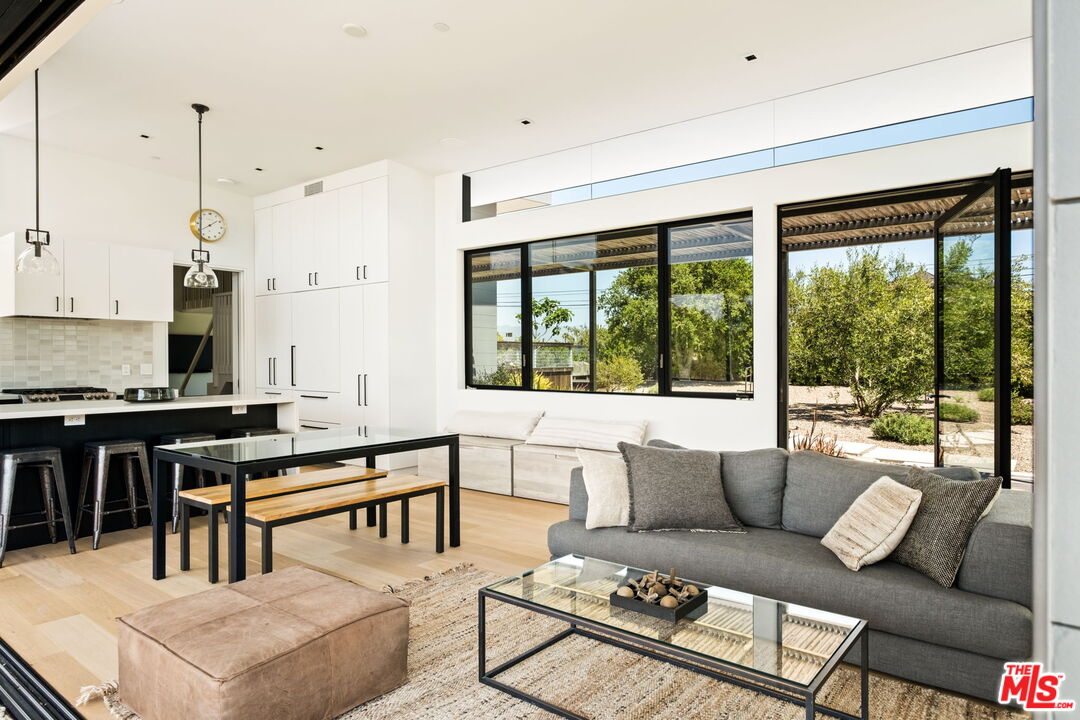 6755 Dume Drive, Unit GH Malibu, CA 90265 - Photo 15 of 31 a living room with furniture and a large window