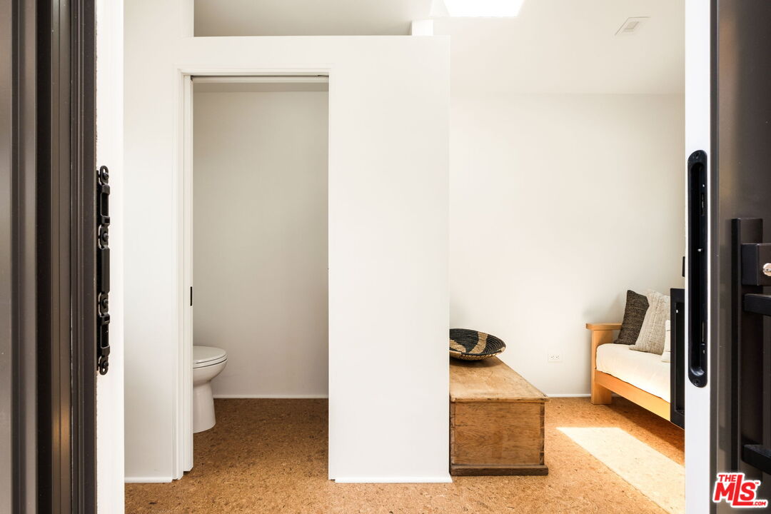 6755 Dume Drive, Unit GH Malibu, CA 90265 - Photo 22 of 31 a en suite bathroom with a toilet