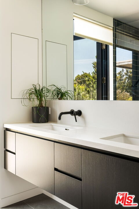 6755 Dume Drive, Unit GH Malibu, CA 90265 - Photo 24 of 31 a view of bathroom with a sink and mirror