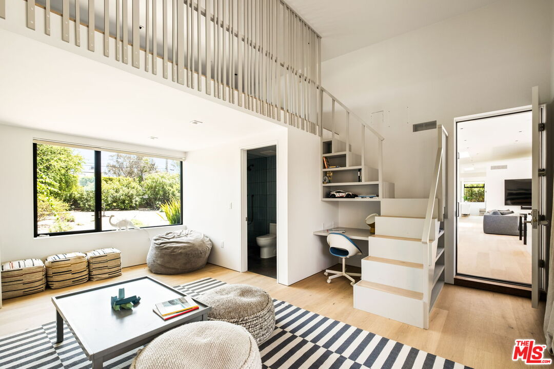 6755 Dume Drive, Unit GH Malibu, CA 90265 - Photo 25 of 31 a bedroom with furniture and a large window