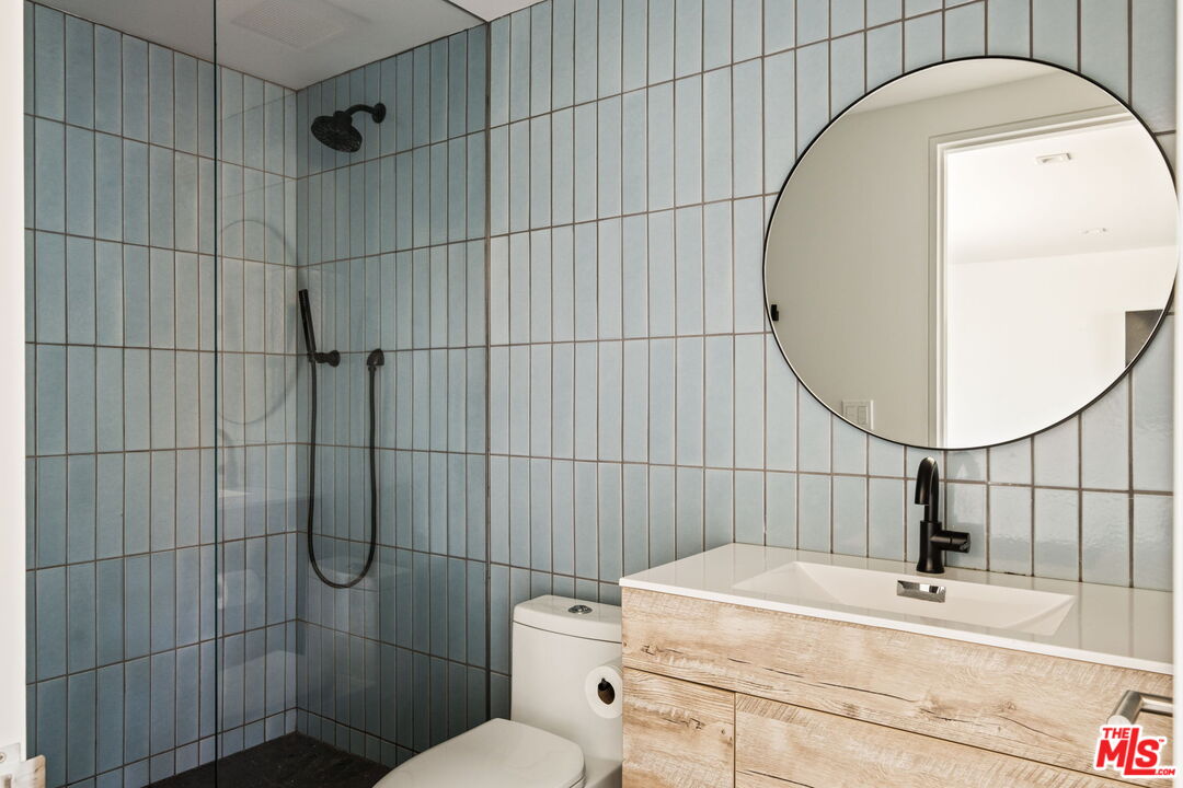 6755 Dume Drive, Unit GH Malibu, CA 90265 - Photo 27 of 31 a bathroom with a sink toilet and shower