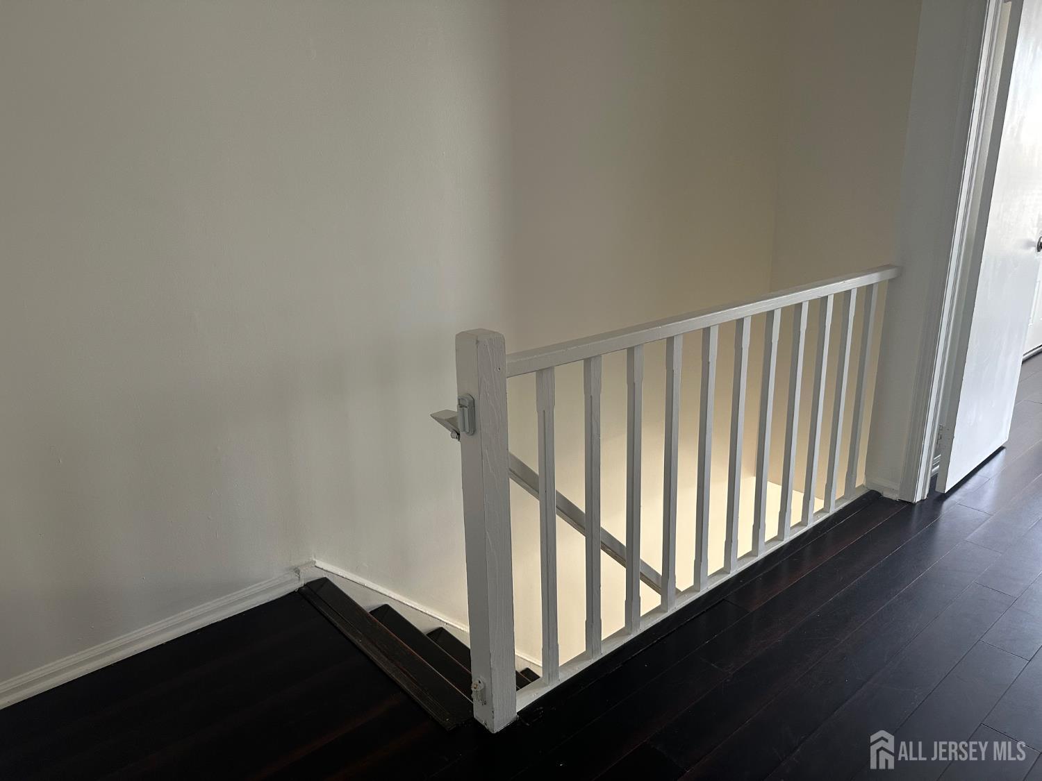 402 Rittenhouse Court North Brunswick, NJ 08902 - Photo 12 of 28 a view of a hallway with wooden floor
