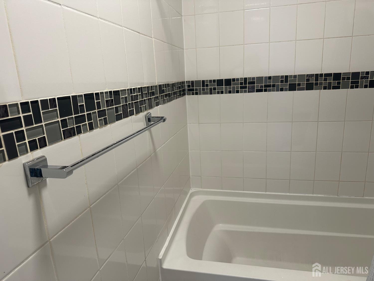 402 Rittenhouse Court North Brunswick, NJ 08902 - Photo 17 of 28 a bathroom with a shower and a bathtub