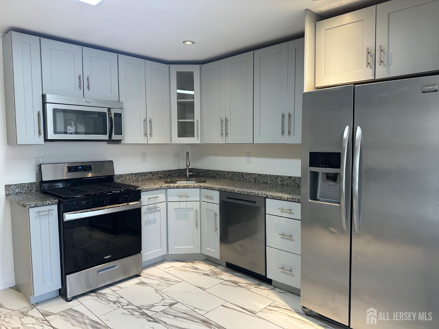 402 Rittenhouse Court North Brunswick, NJ 08902 - Photo 2 of 28 a kitchen with cabinets stainless steel appliances and a counter space