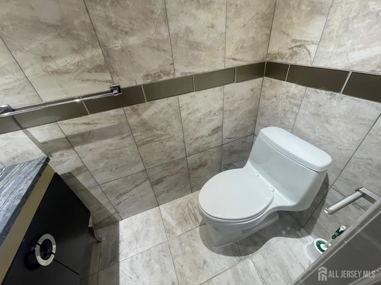 402 Rittenhouse Court North Brunswick, NJ 08902 - Photo 28 of 28 a bathroom with a toilet and a shower