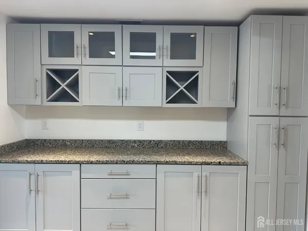 a kitchen with a cabinet and cabinets