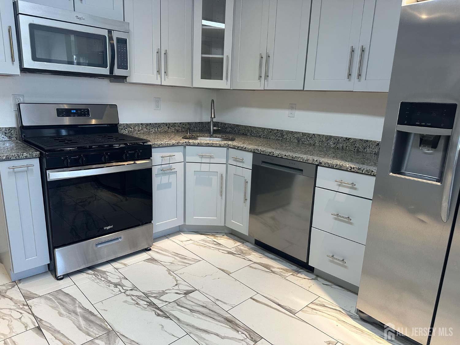 402 Rittenhouse Court North Brunswick, NJ 08902 - Photo 6 of 28 a kitchen with granite countertop white cabinets stainless steel appliances and sink