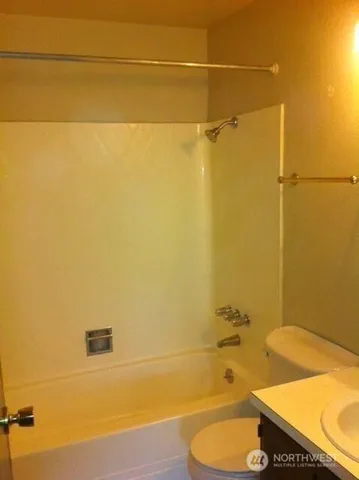 a bathroom with a bathtub and shower