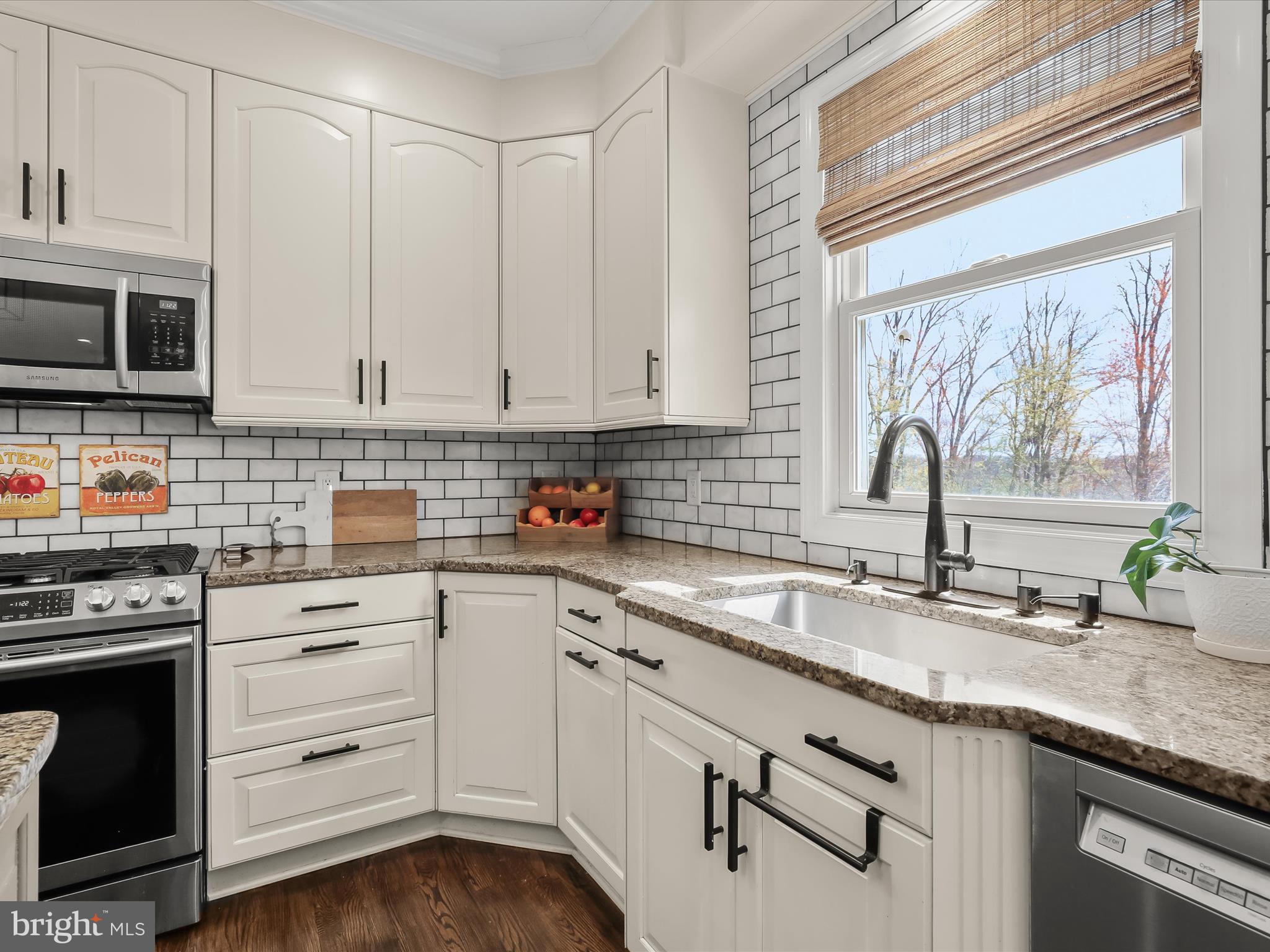 118 Graystone Farm Road White Hall, MD 21161 - Photo 18 of 109 a kitchen with granite countertop white cabinets and white appliances