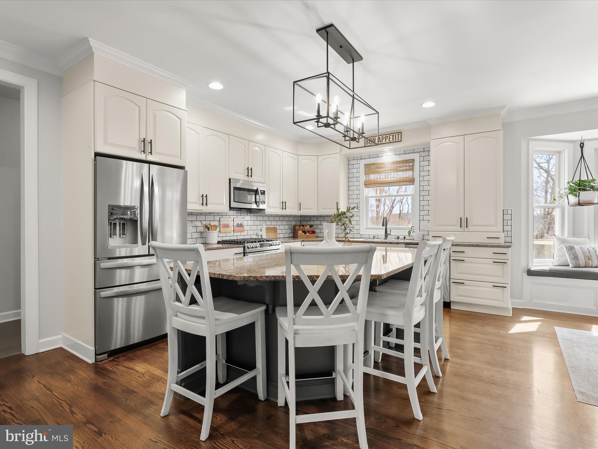 118 Graystone Farm Road White Hall, MD 21161 - Photo 20 of 109 a kitchen with stainless steel appliances a dining table chairs refrigerator and microwave