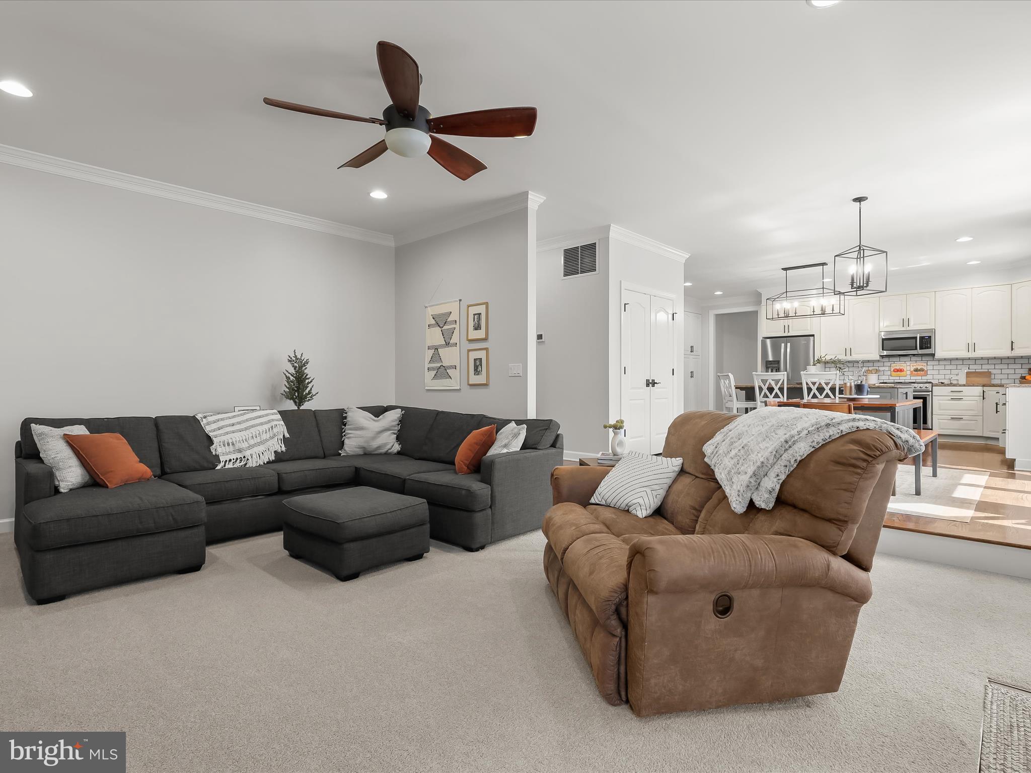 118 Graystone Farm Road White Hall, MD 21161 - Photo 25 of 109 a living room with furniture kitchen view and a chandelier