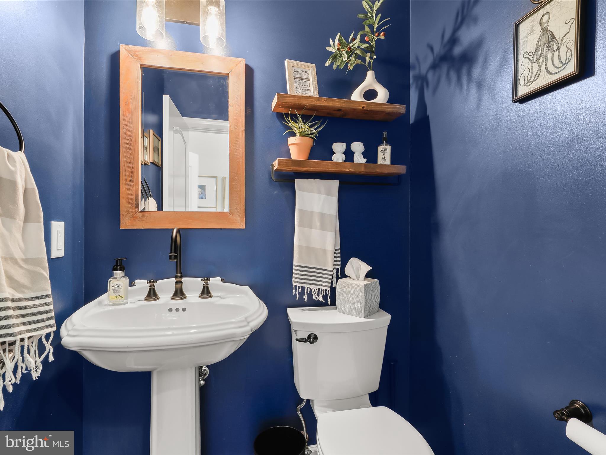 118 Graystone Farm Road White Hall, MD 21161 - Photo 29 of 109 a bathroom with a toilet sink and mirror