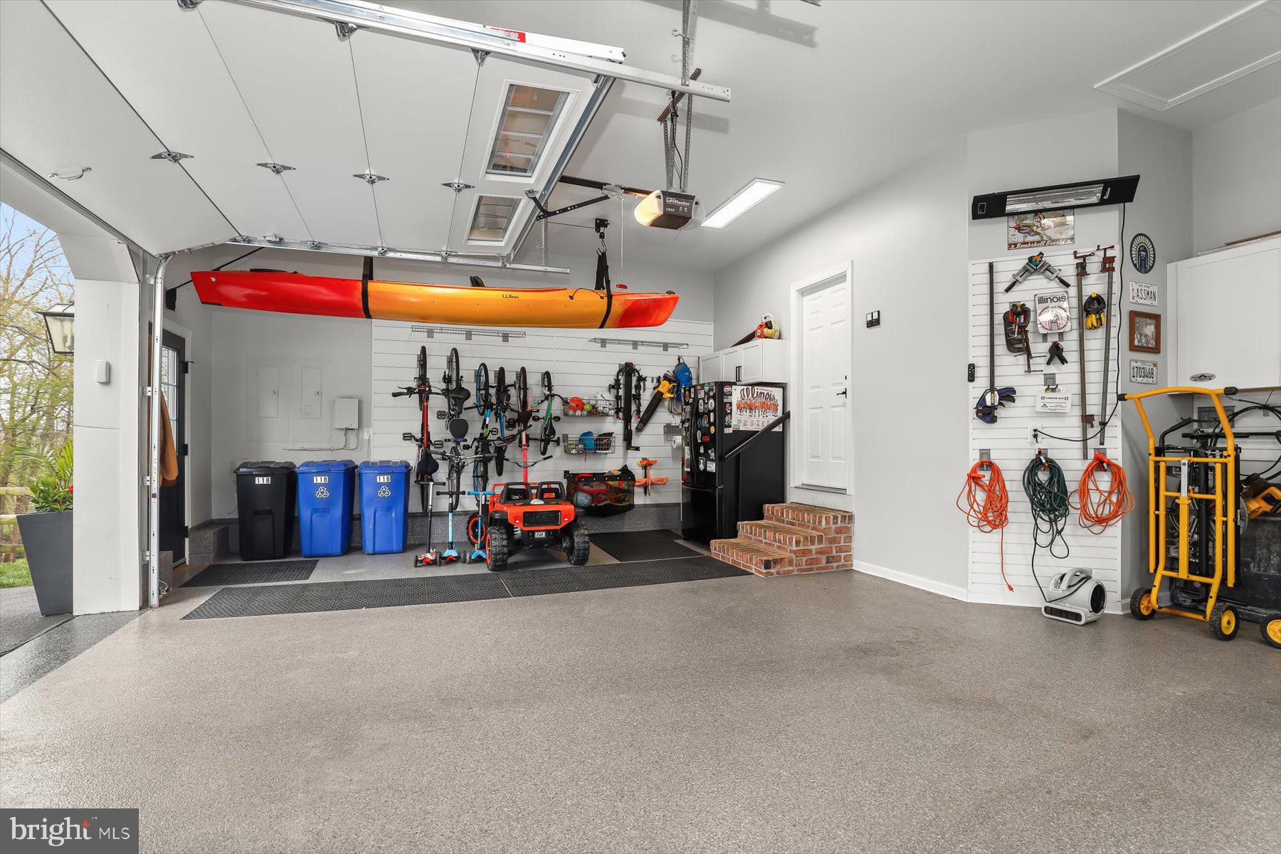 118 Graystone Farm Road White Hall, MD 21161 - Photo 43 of 109 a view of a garage with a bike and a garage