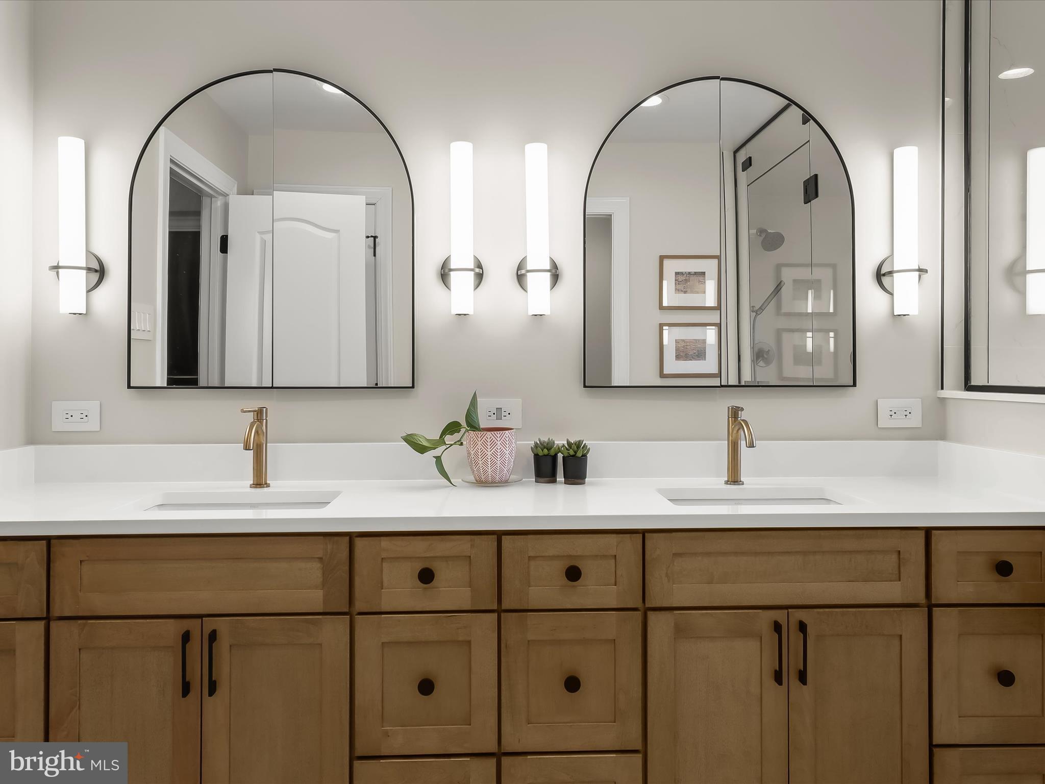 118 Graystone Farm Road White Hall, MD 21161 - Photo 49 of 109 a bathroom with a double vanity sink and a mirror