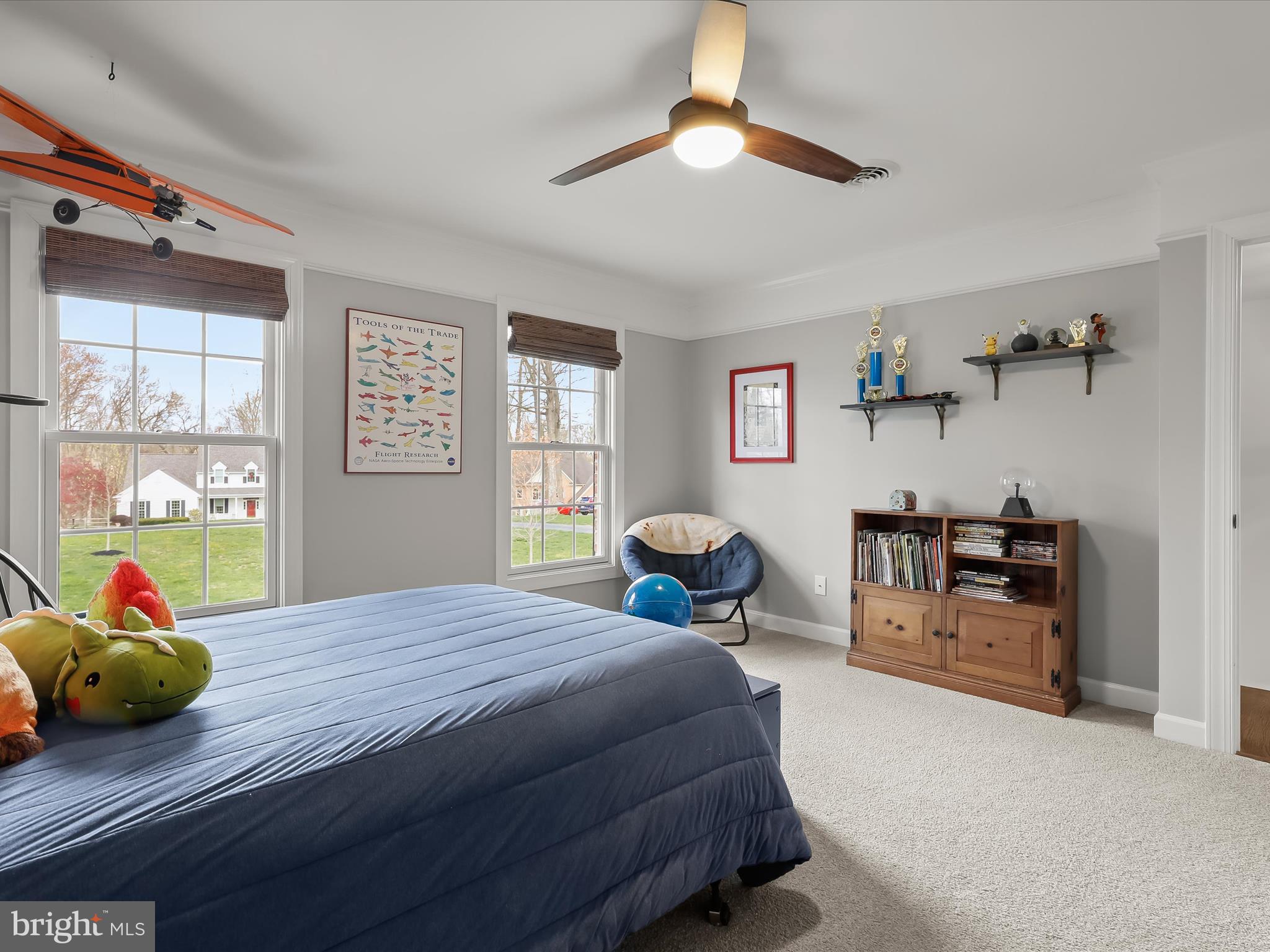 118 Graystone Farm Road White Hall, MD 21161 - Photo 56 of 109 a bedroom with a bed and a chandelier