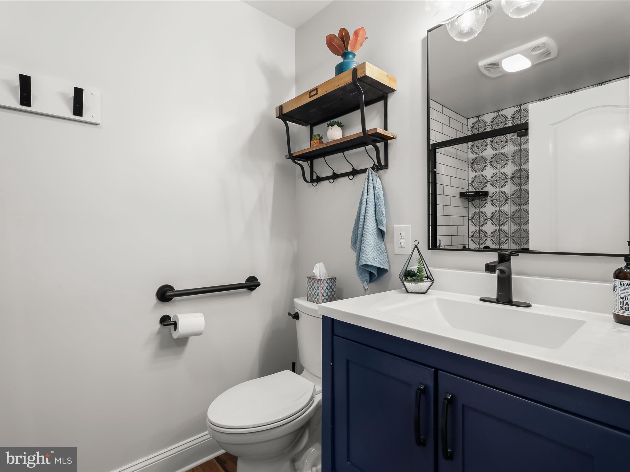 118 Graystone Farm Road White Hall, MD 21161 - Photo 63 of 109 a bathroom with a sink toilet and mirror
