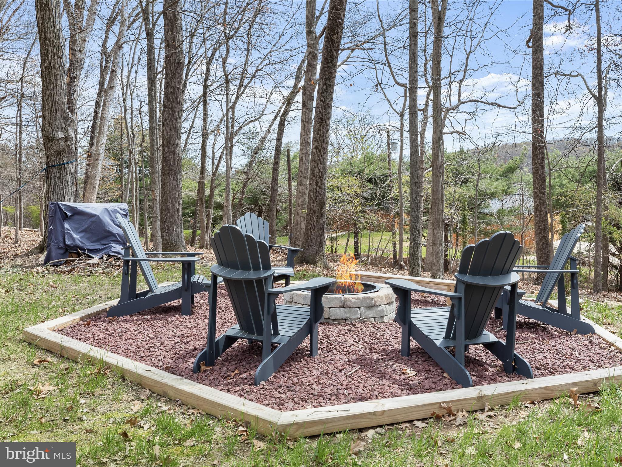 118 Graystone Farm Road White Hall, MD 21161 - Photo 77 of 109 a view of a garden with a bench and some trees