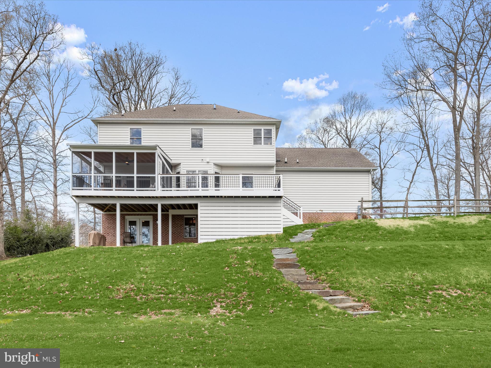 118 Graystone Farm Road White Hall, MD 21161 - Photo 81 of 109 a front view of a house with a garden and plants