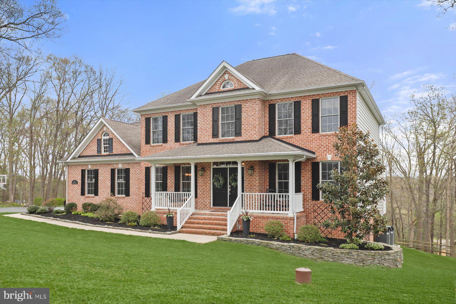 118 Graystone Farm Road White Hall, MD 21161 - Photo 85 of 109 a front view of a house with a yard and trees