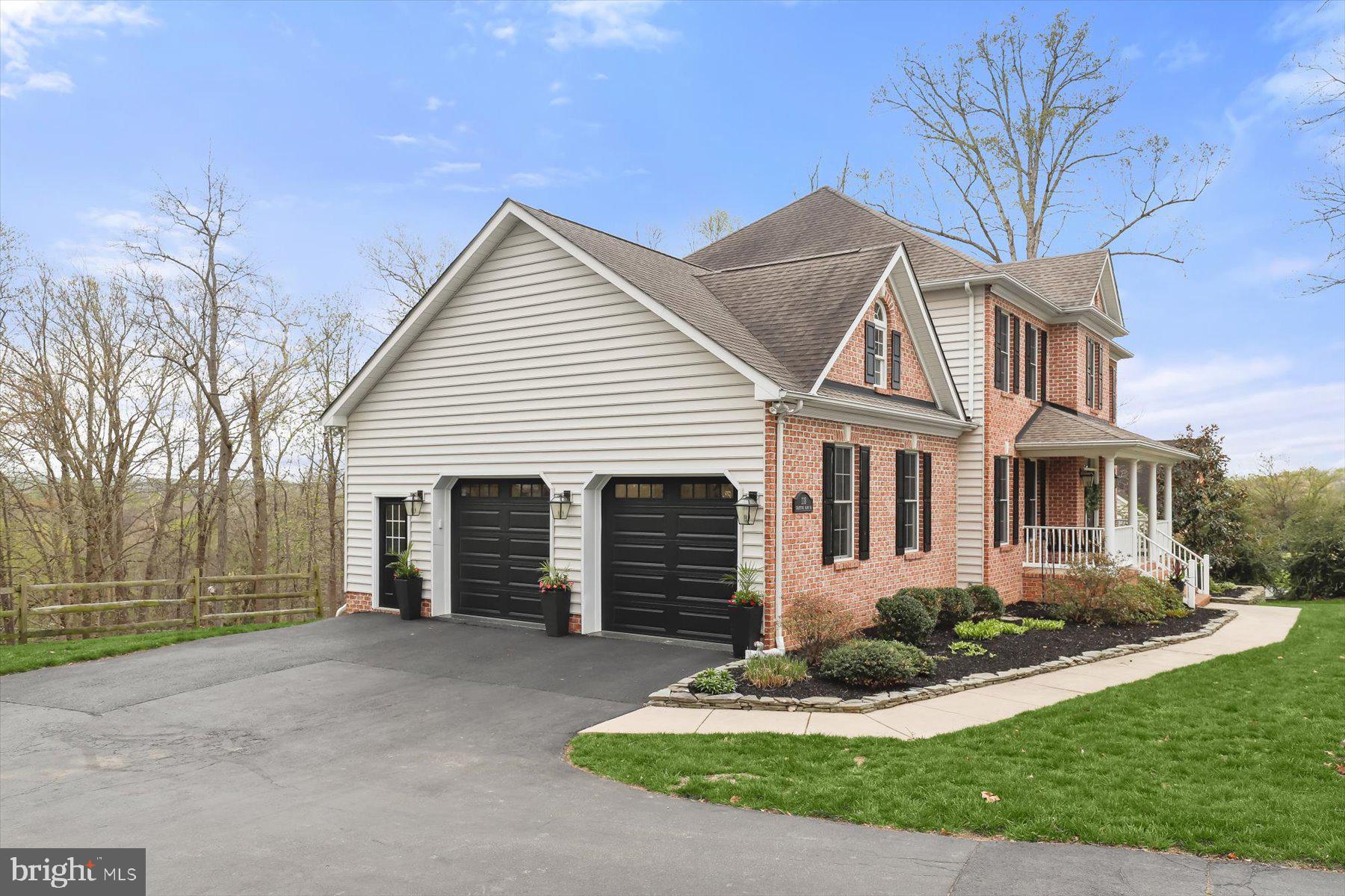 118 Graystone Farm Road White Hall, MD 21161 - Photo 90 of 109 a front view of a house with a yard and garage