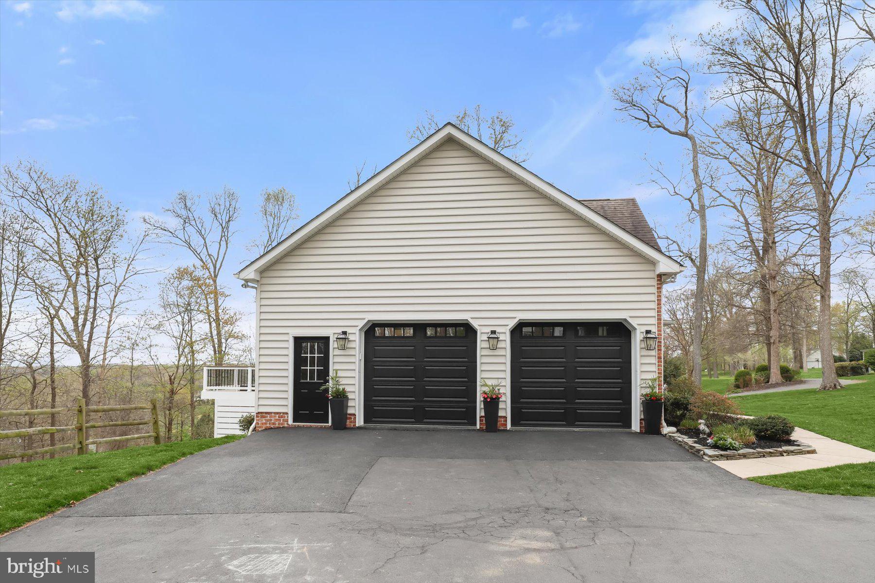 118 Graystone Farm Road White Hall, MD 21161 - Photo 91 of 109 a view of a house with a yard and garage