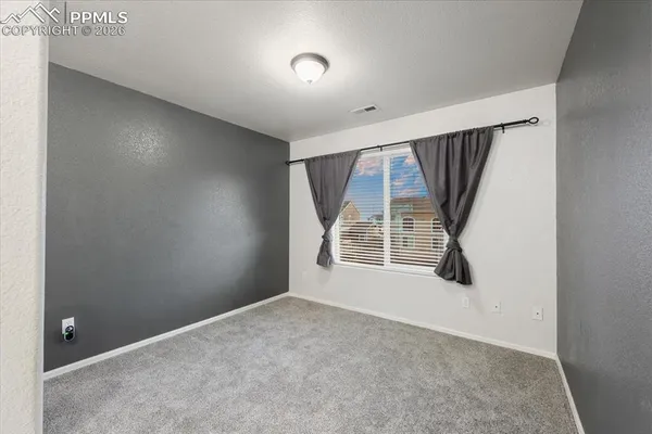 a view of a room with racks on the wall