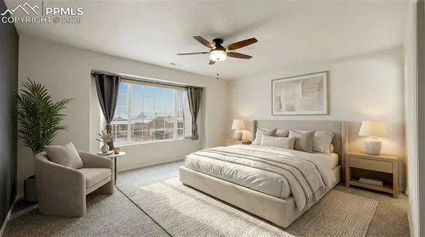 an empty room with fan and windows