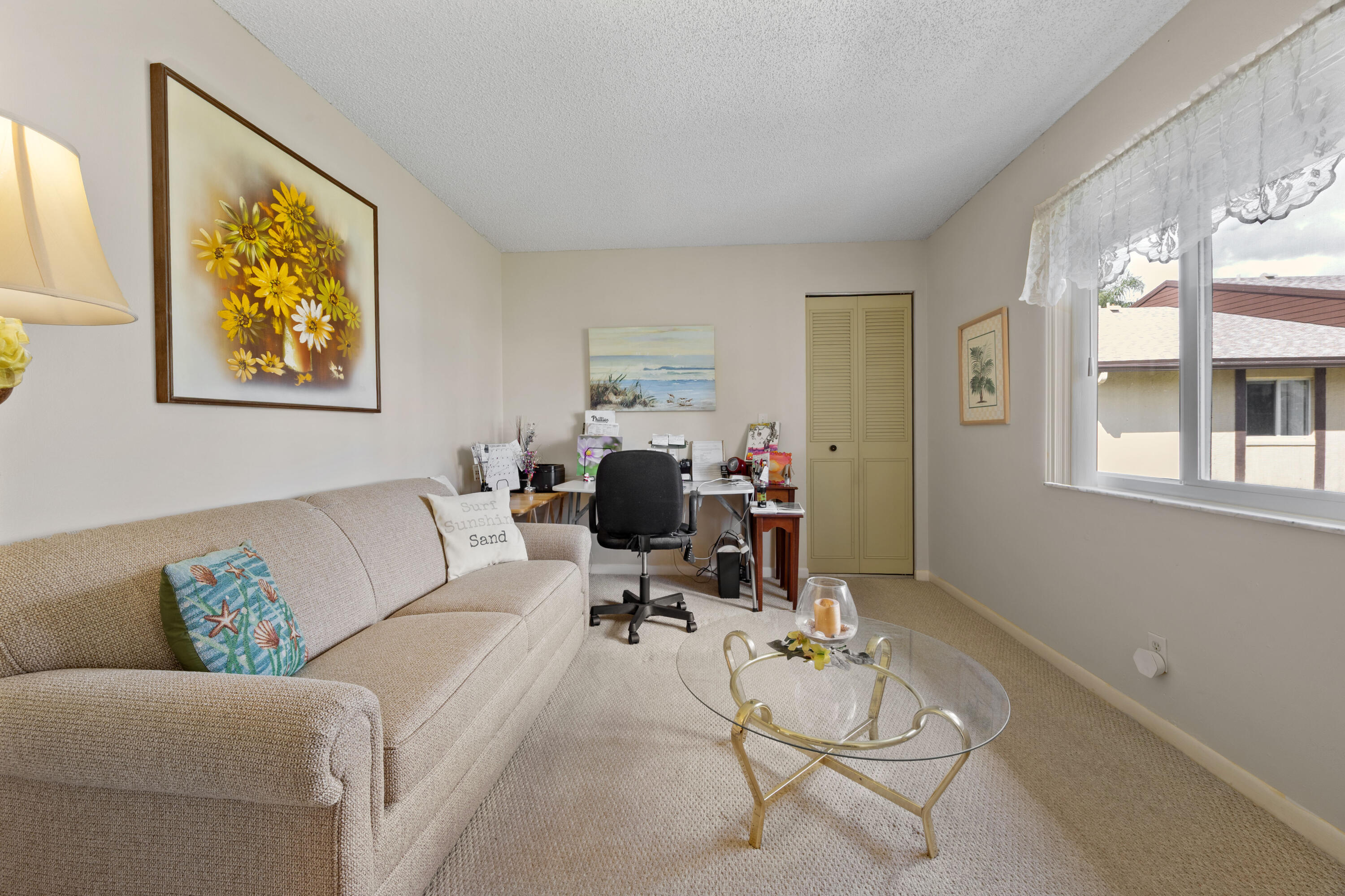 306 Pine Ridge Circle, Unit B2 Greenacres, FL 33463 - Photo 13 of 15 a living room with furniture and a window