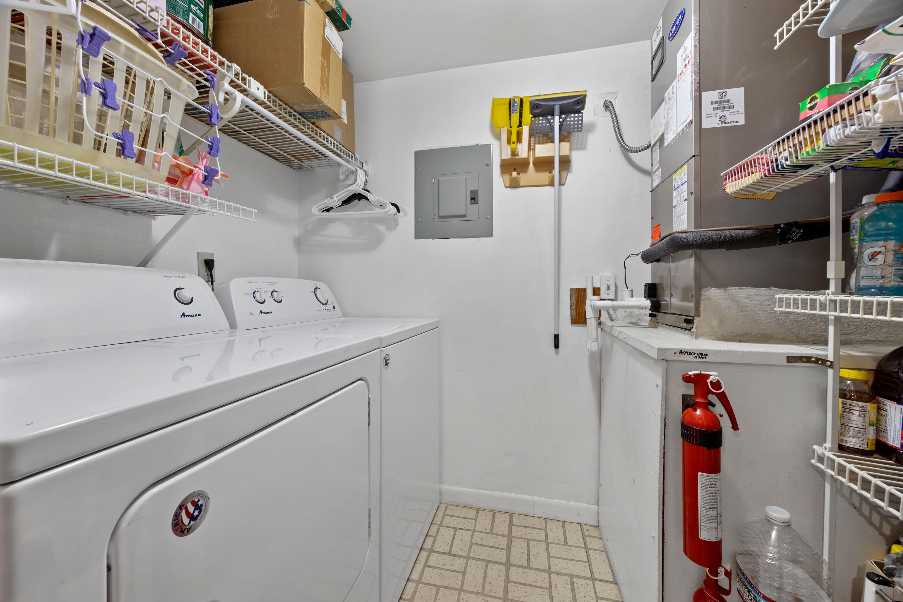 306 Pine Ridge Circle, Unit B2 Greenacres, FL 33463 - Photo 9 of 15 a utility room with dryer and washer