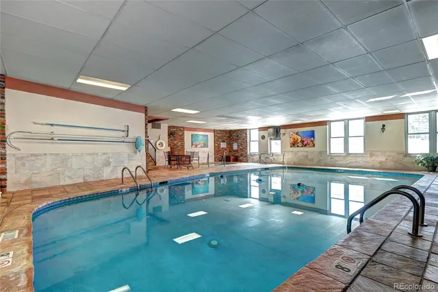 a view of a swimming pool with a yard