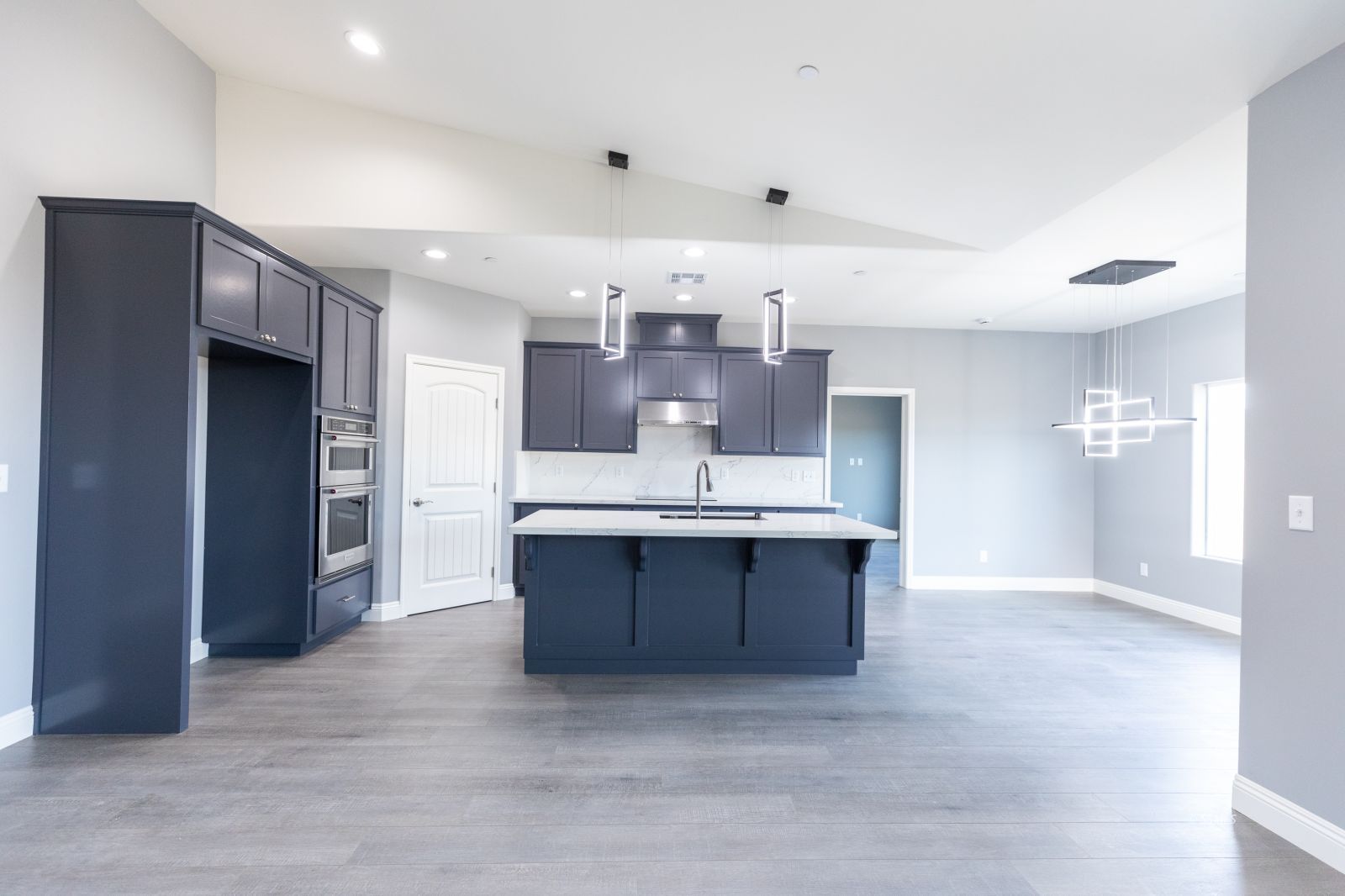 424 Thomas Street Ridgecrest, CA 93555 - Photo 7 of 30 a kitchen with stainless steel appliances a sink and a refrigerator