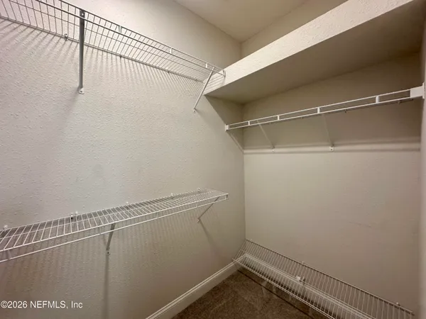 a view of a room with racks on the wall