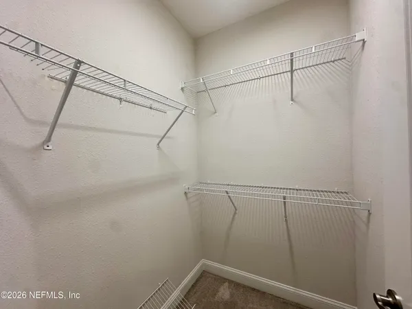 a view of a room with racks on the wall