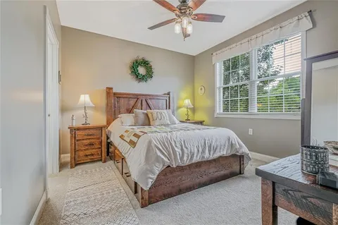 a bedroom with a bed and a table in it