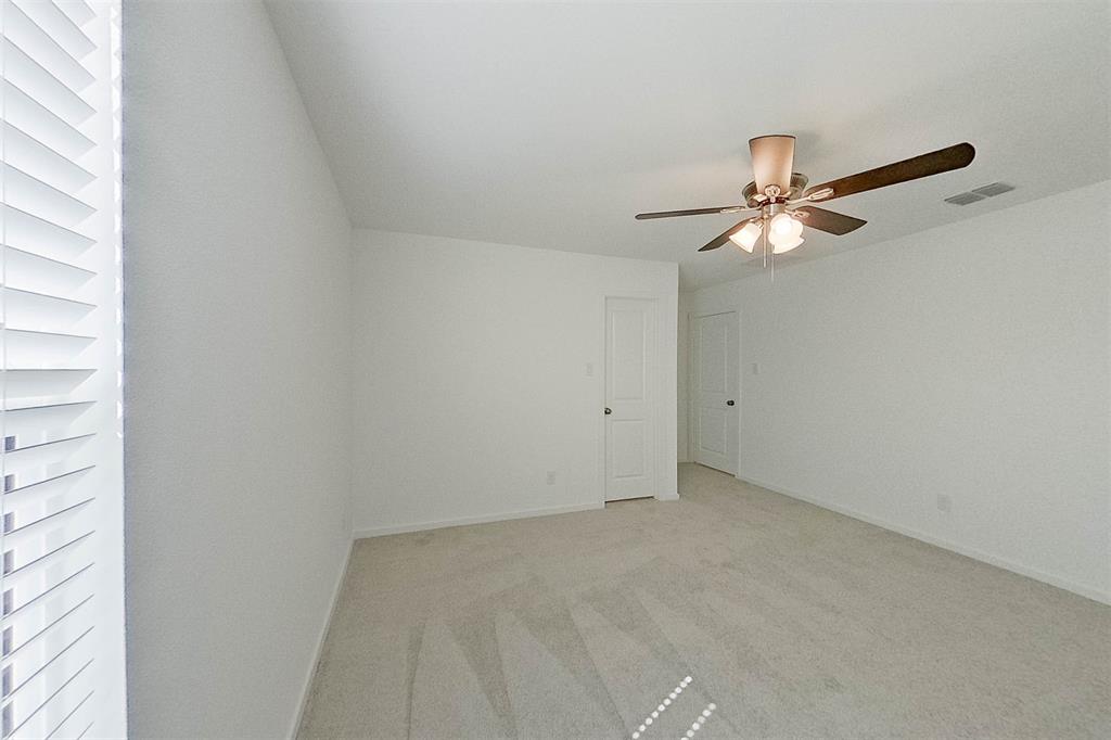 814 Ginkgo Way Princeton, TX 75407 - Photo 15 of 24 a view of a room with a fan and a window