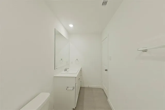 a bathroom with a shower a toilet and sink