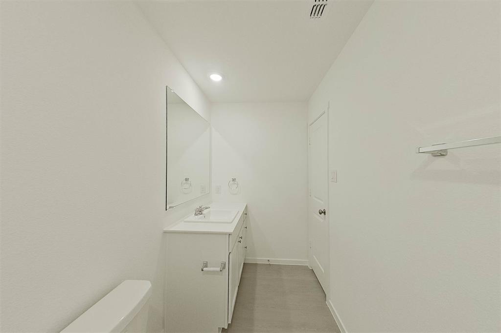 814 Ginkgo Way Princeton, TX 75407 - Photo 16 of 24 a bathroom with a sink and a toilet