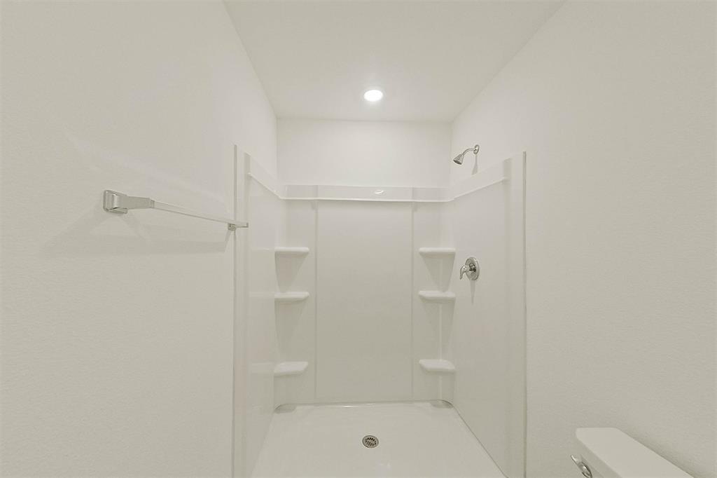 814 Ginkgo Way Princeton, TX 75407 - Photo 17 of 24 a bathroom with a shower a toilet and sink