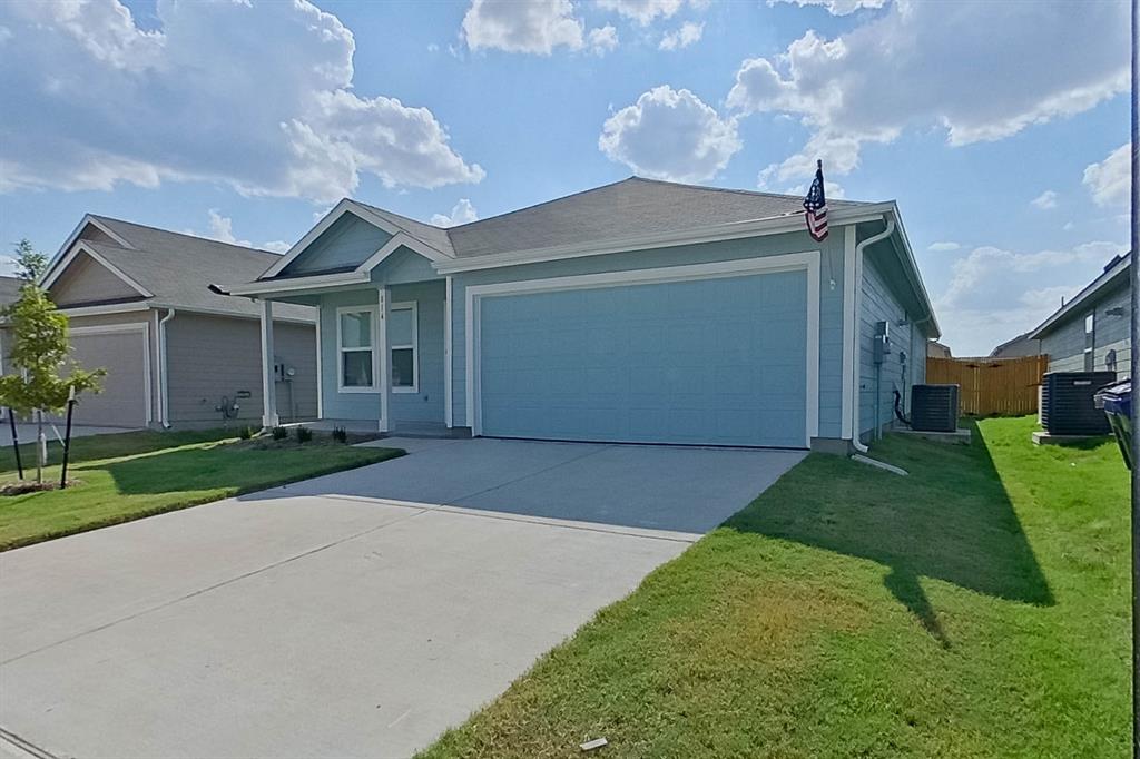 814 Ginkgo Way Princeton, TX 75407 - Photo 2 of 24 a front view of a house with a yard and garage