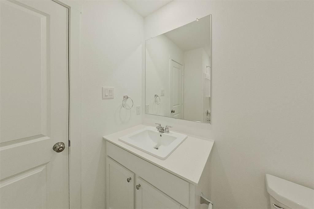 814 Ginkgo Way Princeton, TX 75407 - Photo 9 of 24 a bathroom with a sink a toilet and shower
