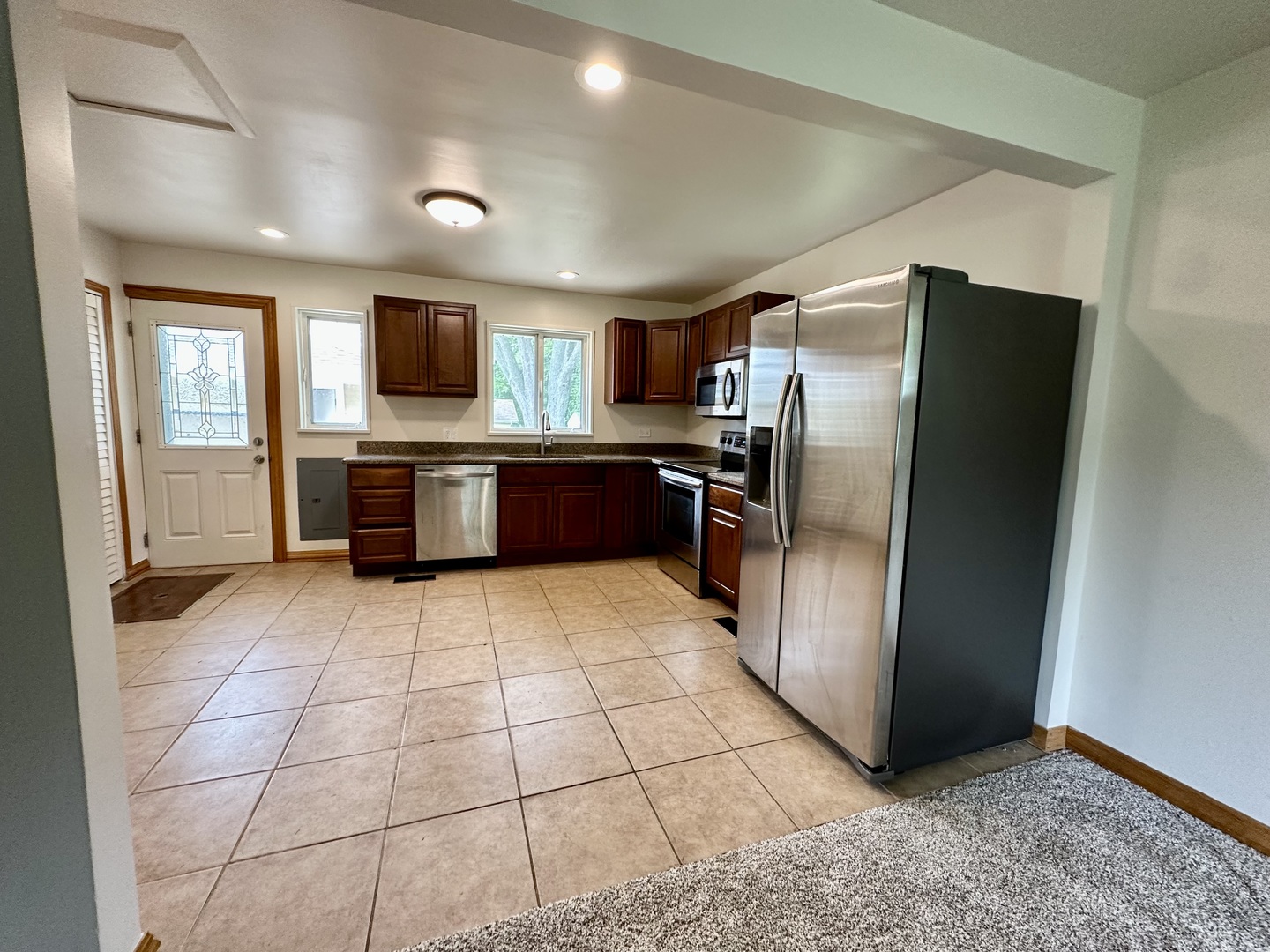 60 Golfview Road Lake Zurich, IL 60047 - Photo 6 of 10 a kitchen with stainless steel appliances granite countertop a refrigerator and a sink