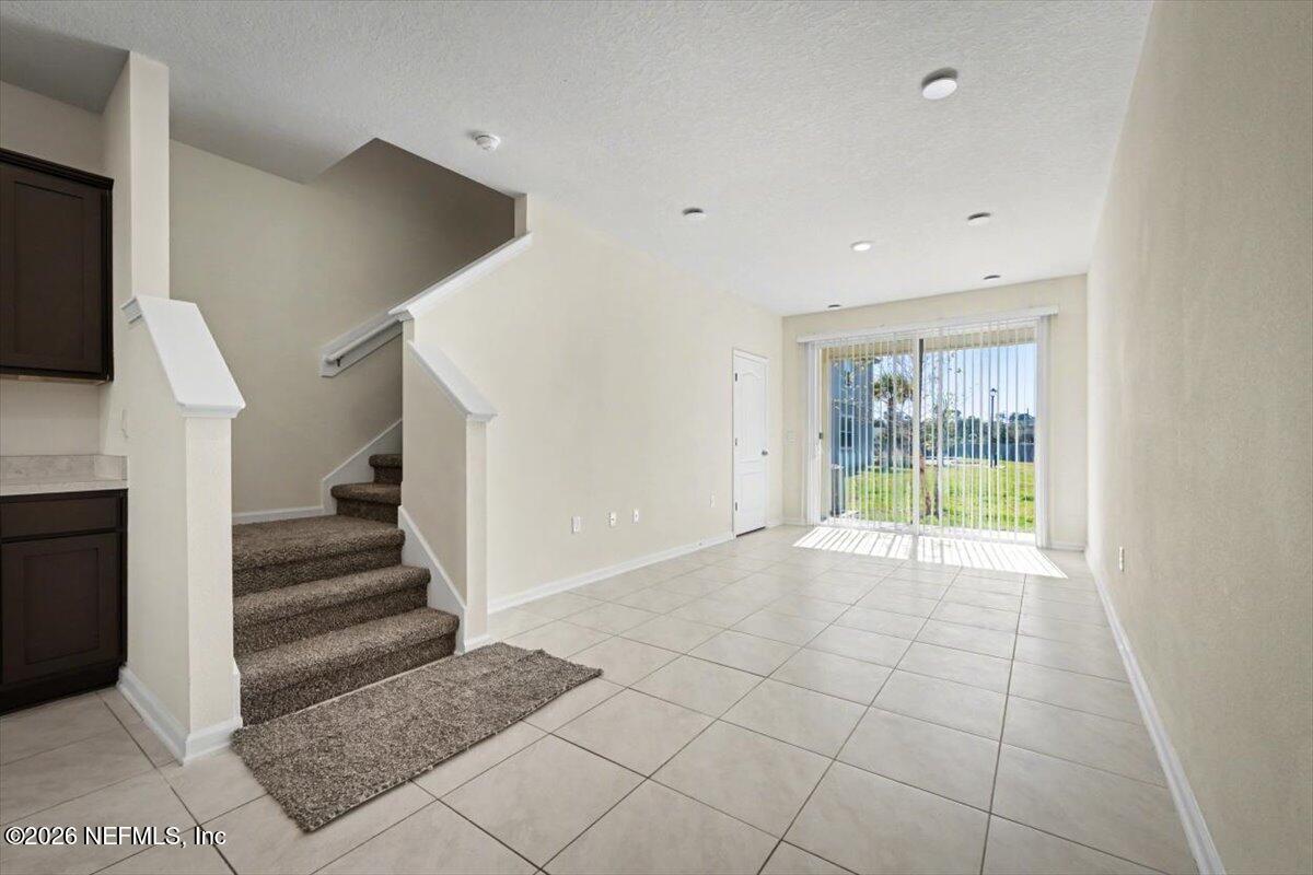 8212 Larose Road Jacksonville, FL 32211 - Photo 12 of 32 a view of an entryway with staircase