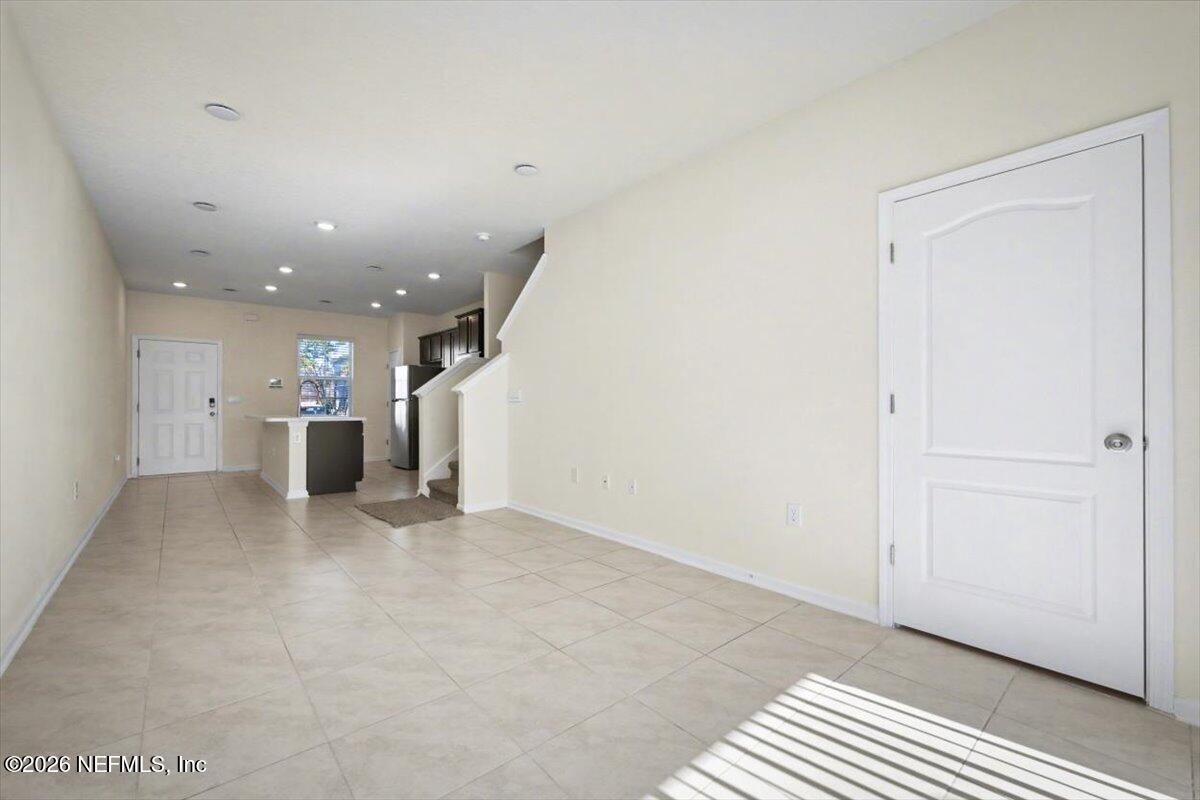 8212 Larose Road Jacksonville, FL 32211 - Photo 13 of 32 a view of a big room with closet and windows