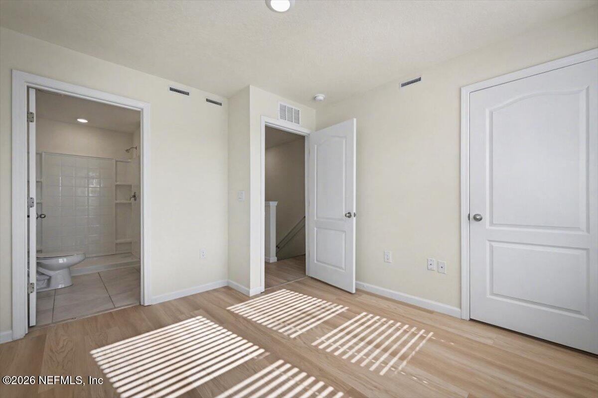 8212 Larose Road Jacksonville, FL 32211 - Photo 15 of 32 a view of a bathroom with a shower and a toilet