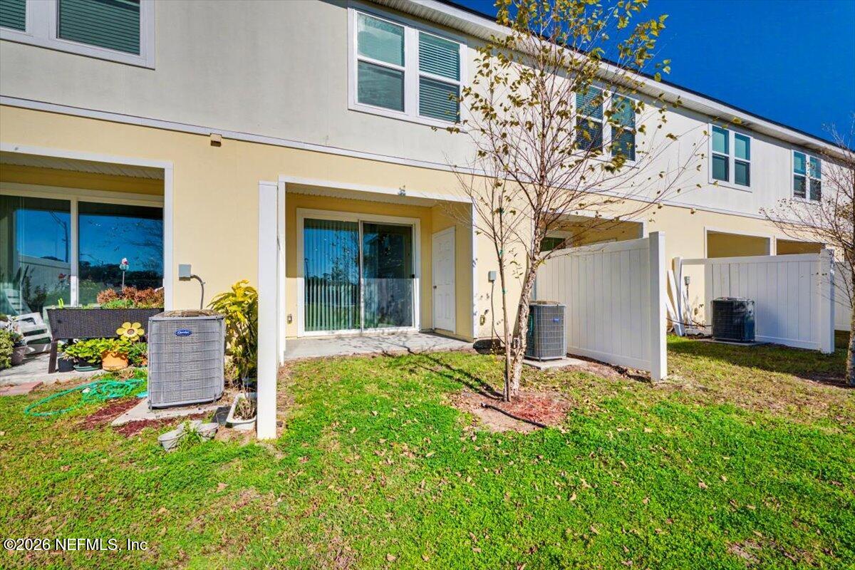 8212 Larose Road Jacksonville, FL 32211 - Photo 23 of 32 a view of a chair and table in backyard of the house